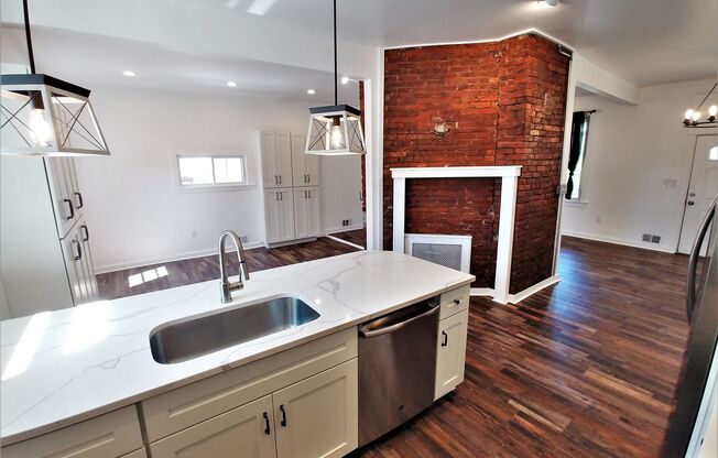 GORGEOUS, large 3 bedroom stand alone house w/ master suite, quartz, stainless, a/c, laundry, and parking!