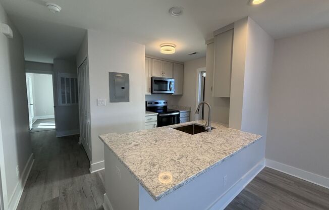 Breathtaking 2 Bed/2 Bath Condo - Second Floor - Newly Renovated - Covered Balcony - Community Amenities - Washer/Dryer Included