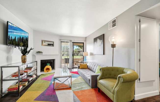 a living room with a couch and a fireplace