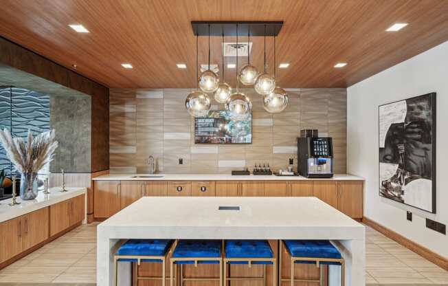 a large kitchen with a marble counter top and wooden cabinets