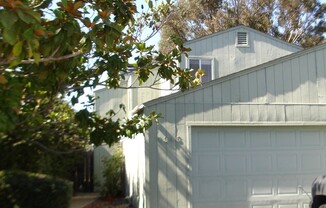 Townhouse Style 3bd/2ba Condo w/ Two Car Garage and Small Backyard