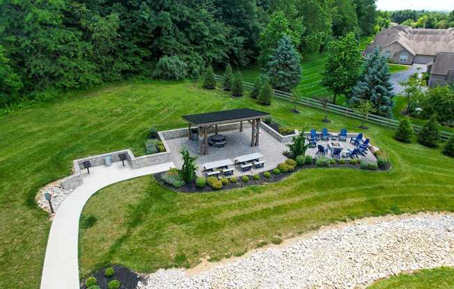 A backyard with a gazebo and a patio area.