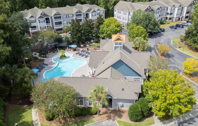 an aerial view of a house with a swimming pool