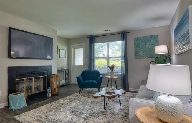 a living room with a fireplace and a tv above it