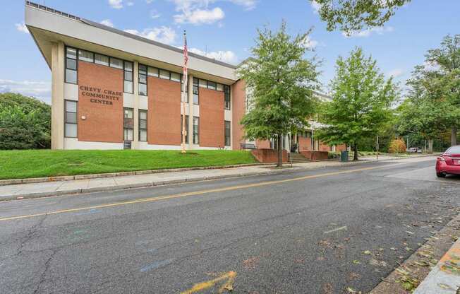 A Chevy Chase Community Center building with a red car parked in front.