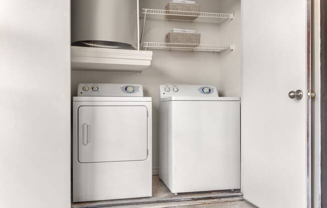 a small laundry room with a washer and dryer