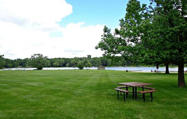 picnic area along side lamberton lake in grand rapids at Lamberton Lake Apartments