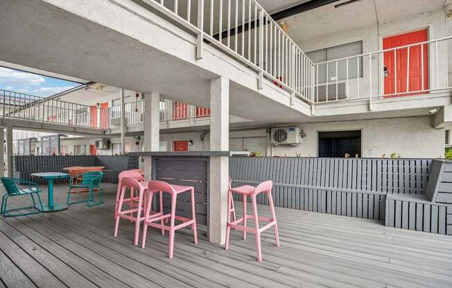 A patio with a table and chairs.