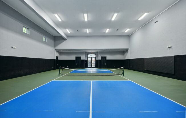 View of Pickleball Court, Showing 2 Tone Walls and court floors at Cottonwood Ridgeview Apartments