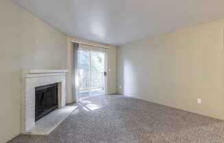 Cascadia Pointe Apartments in Everett, Washington Living Room with Fireplace and Private Patio