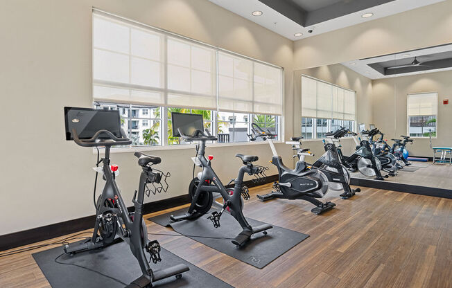 a gym with exercise bikes and other fitness equipment