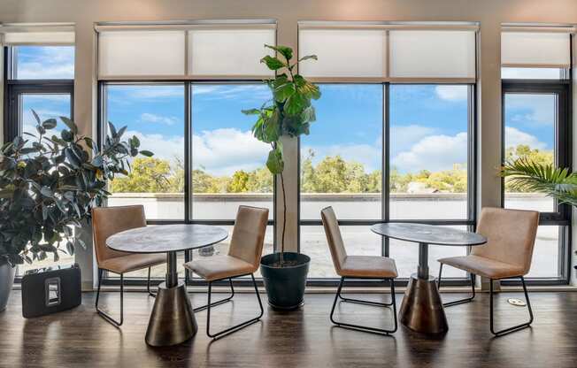 a meeting room with tables and chairs and large windows at Barrington 101, Barrington, IL 60010