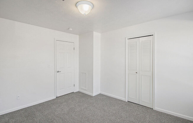 spacious bedroom with walk in closet at Canal 2 Apartments, Lansing, Michigan
