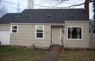 2 bedroom/1 bath home with garage and large fenced back yard