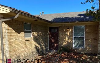 Spacious living in this recently updated 3 bedroom, 2 bathroom house with attached garage in the back