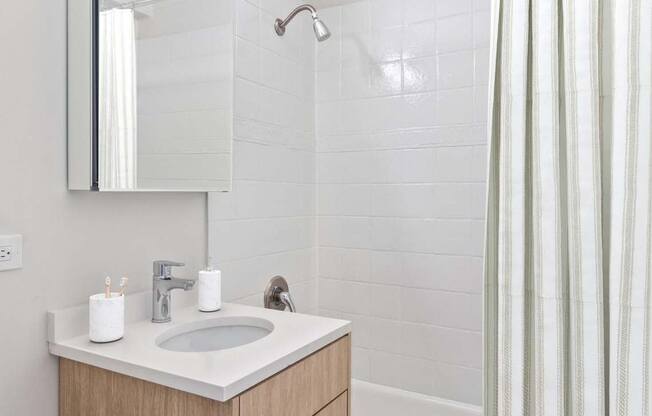 a bathroom with a sink and a shower