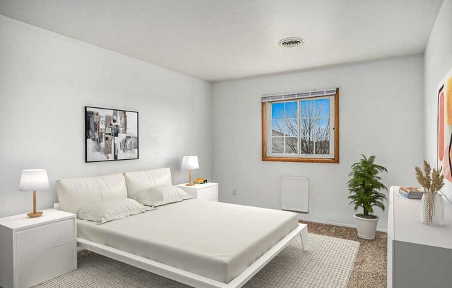 A bedroom with a bed, two lamps, and a potted plant.