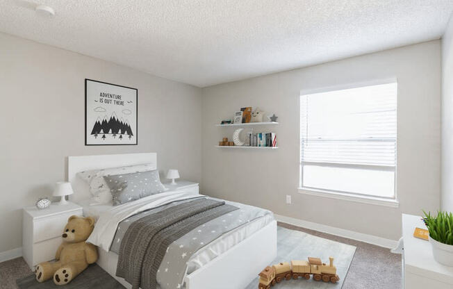Model Bedroom with Carpet and Window View at Indigo Park Apartments in Albuquerque, NM.