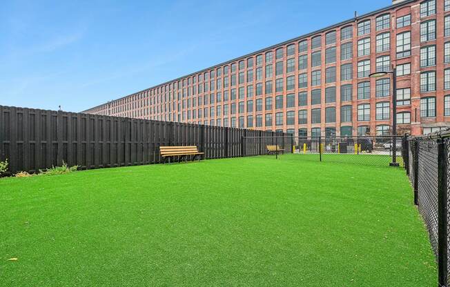 a green lawn in front of a large building