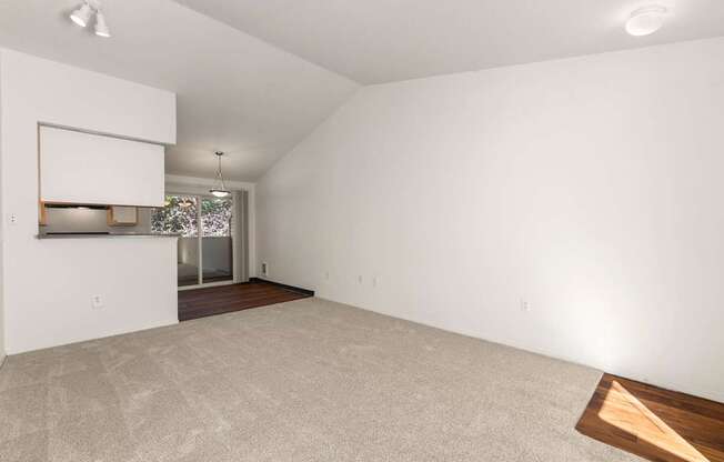 Empty room with a window and a door at Clackamas Trails Apartments, Oregon, 97222