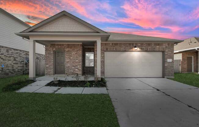 A house with a garage and a driveway.