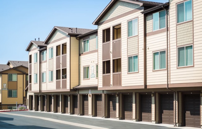 an empty street in front of a row of town houses
