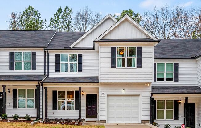 MOVE IN READY! BRAND NEW 4 bedroom 2.5 bathroom townhome with GARAGE and WOODED VIEW!