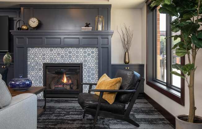 View of cozy clubhouse with fire place and seating area at The Whitley in St. Paul, MN.
