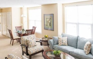 2-bedroom ranch style apartment with great room with kitchen with breakfast bar, living and dining areas, and large, bright windows