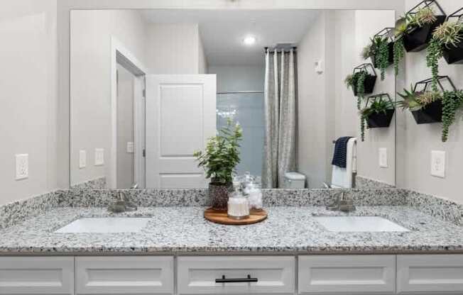 A bathroom with a granite countertop at Century Grove Park, Knightdale, NC