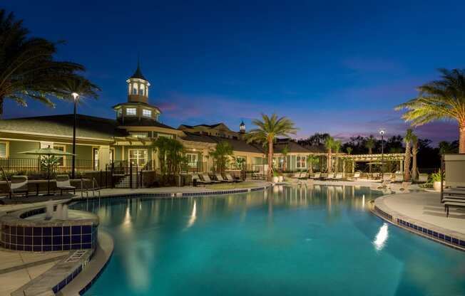 Swimming Pool at Dusk at Integra 360 Apartments in Winter Springs, FL