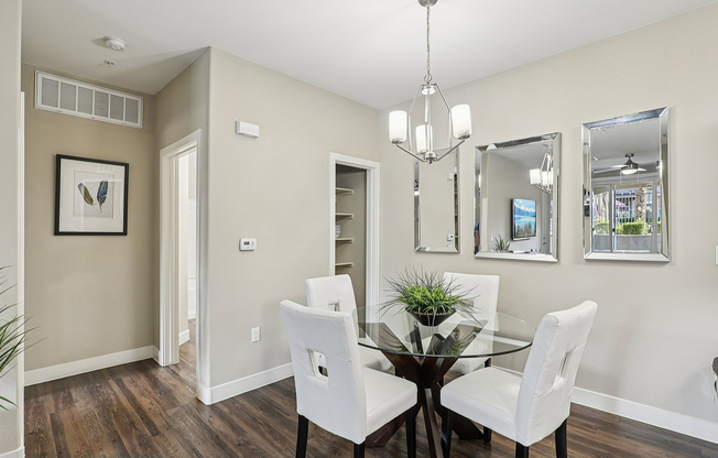 Dining Area with Wood Floors and Modern Lighting