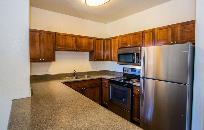 Full Upgraded Kitchen with Stainless Steel Appliances and Granite Countertops at Apartments in Deer Valley AZ