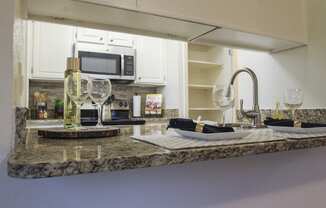 This is a photo of the kitchen of a 1245 square foot 2 bedroom apartment at Cambridge Court Apartments.