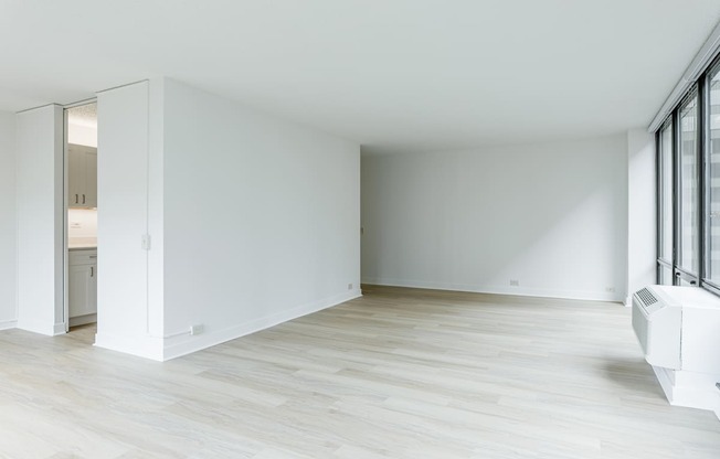 A white room with a sliding door and a window.