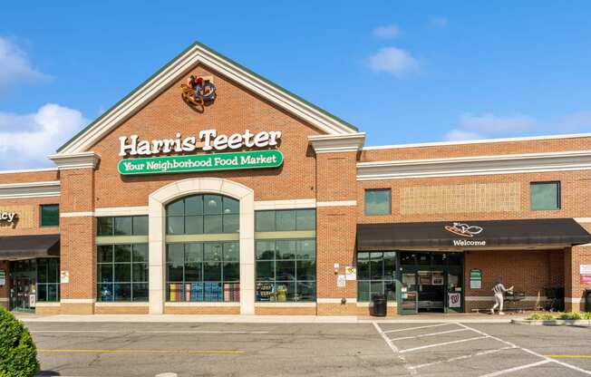 the front of a harris teeter store in a parking lot