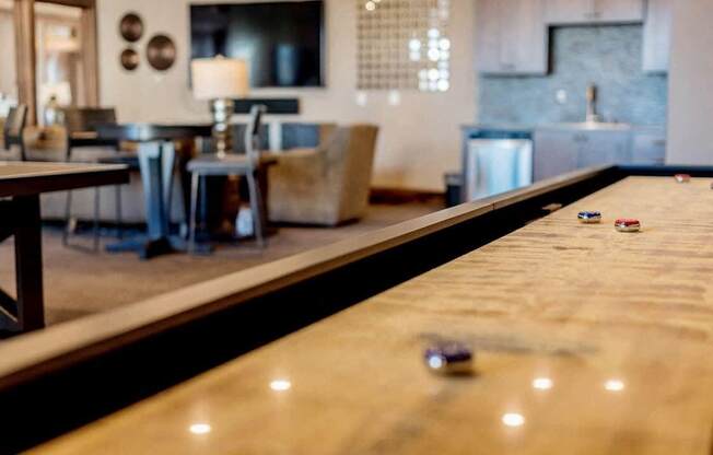 a shuffleboard table in the clubhouse at the residences at silver hill in suitland, md