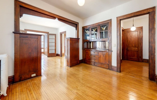 Stunning Layout with Accenting Wood Trim and Natural Restored Hardwood Flooring at The Park Apartments in Minneapolis