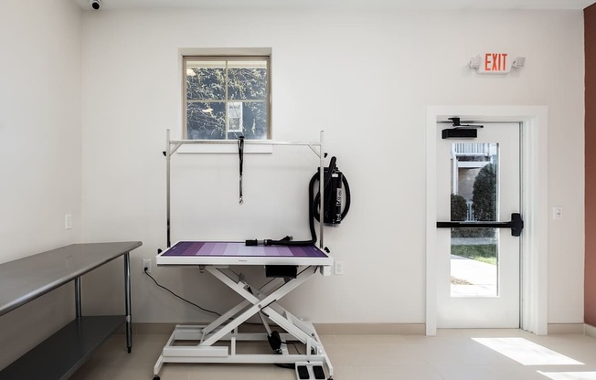 A room with a table and a window.