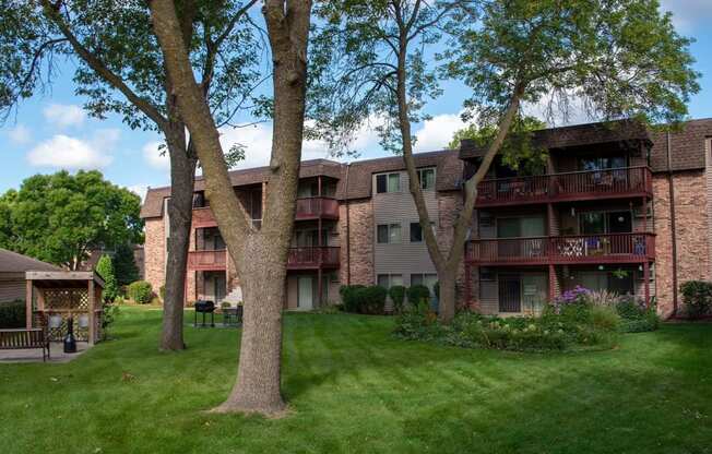 Trees and freshly mowed grass outside of Plymouth Pointe