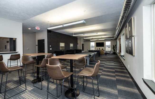 A conference room with a long table and chairs.