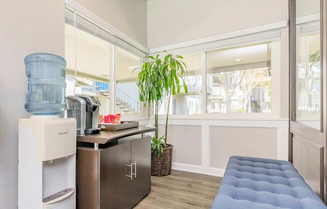 a room filled with furniture and a large window