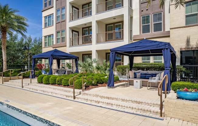 the preserve at ballantyne commons pool and patio with umbrellas and chairs