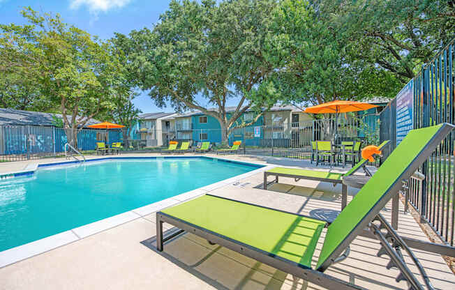 our apartments have a resort style pool and lounge chairs