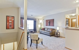 a living room with a couch and a chair