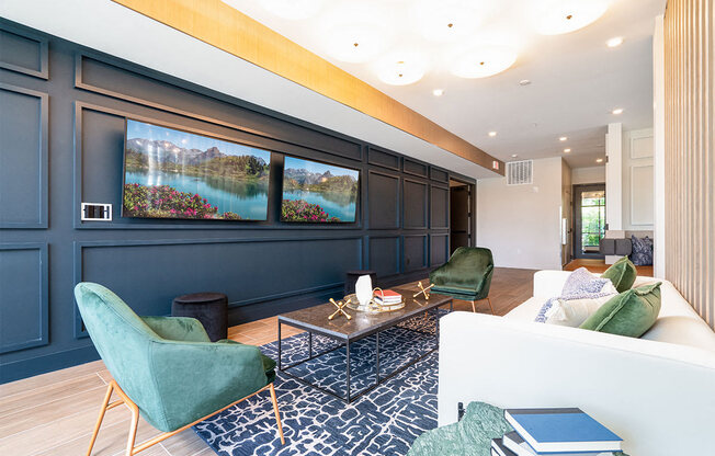 a living room with blue walls and a couch and chairs