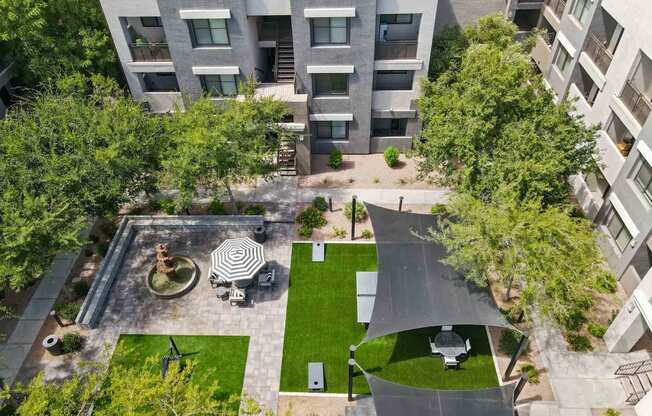 an aerial view of an apartment complex with a courtyard