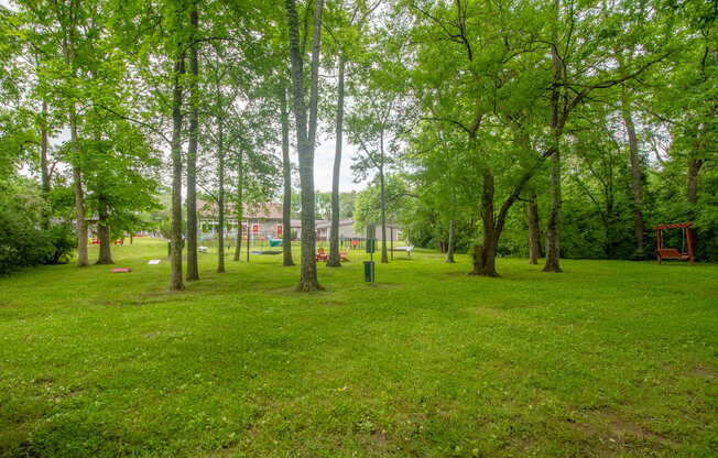 Retreat at Indian Lake Apartments park with green grass and trees.
