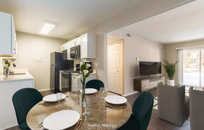 a kitchen and dining area in a 555 waverly unit