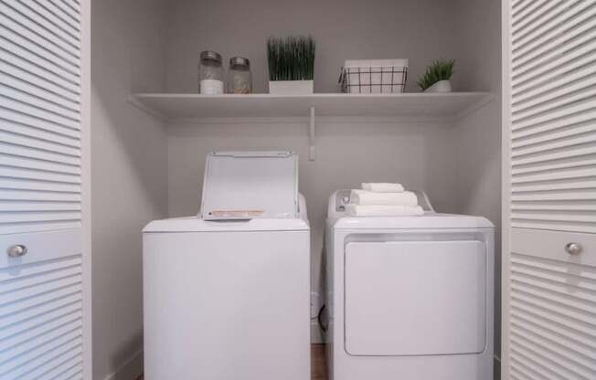 a white washer and dryer in a laundry room at Sonder Fields in Happy Valley, OR